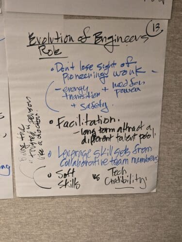 Handwritten note card titled 'Evolution of Engineers' with blue ink bullets about energy transition and safety